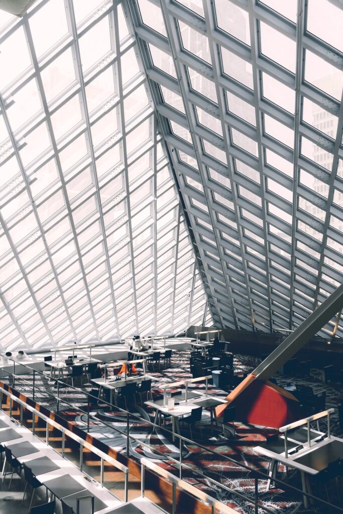 Reading tables under the sloping steel-and-glass lattice roof of the Seattle Central Library
